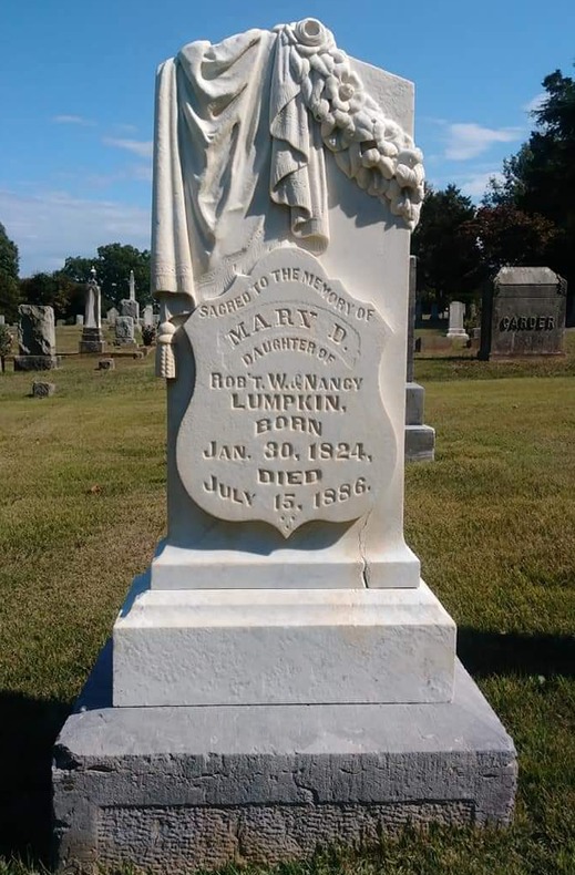 Same headstone restored after cleaning